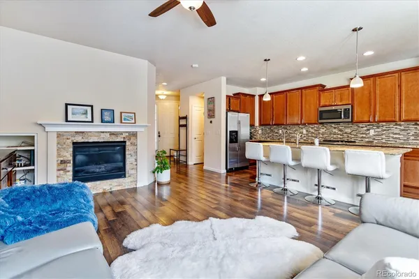 a living room with furniture and a fireplace
