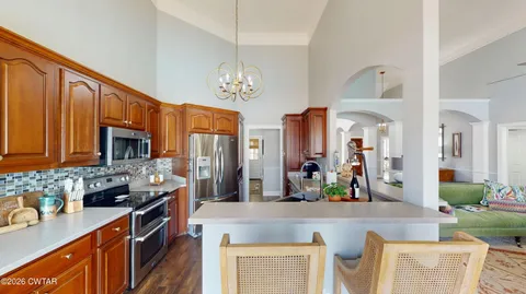 a spacious bathroom with a mirror a sink and large window