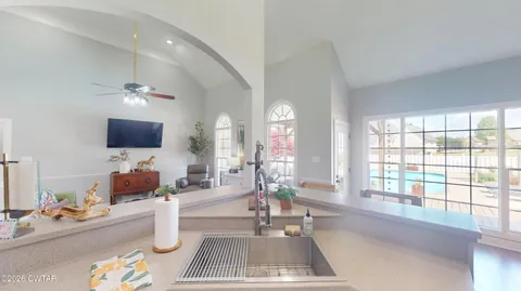 a bedroom with a bed couch and a window