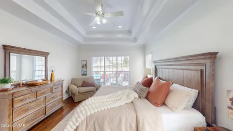 a bedroom with a bed and a couch