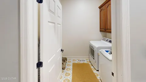 a bedroom with a bed and a potted plant