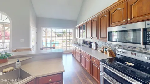 a living room with furniture fireplace and wooden floor