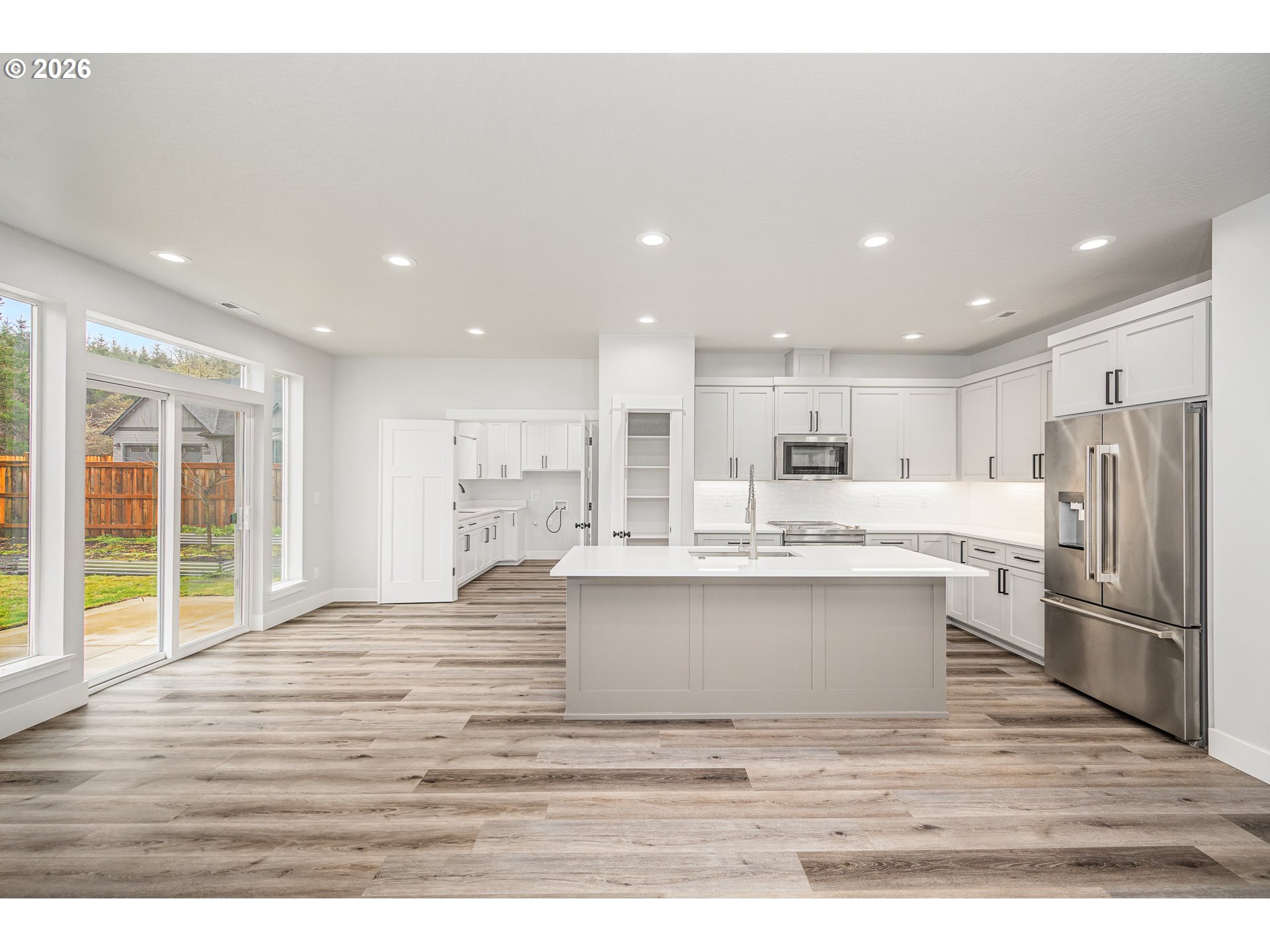 24678 Perkins Road, Unit LOT 26 Veneta, OR 97487 - Photo 14 of 48 a view of kitchen with stainless steel appliances granite countertop cabinets and wooden floor