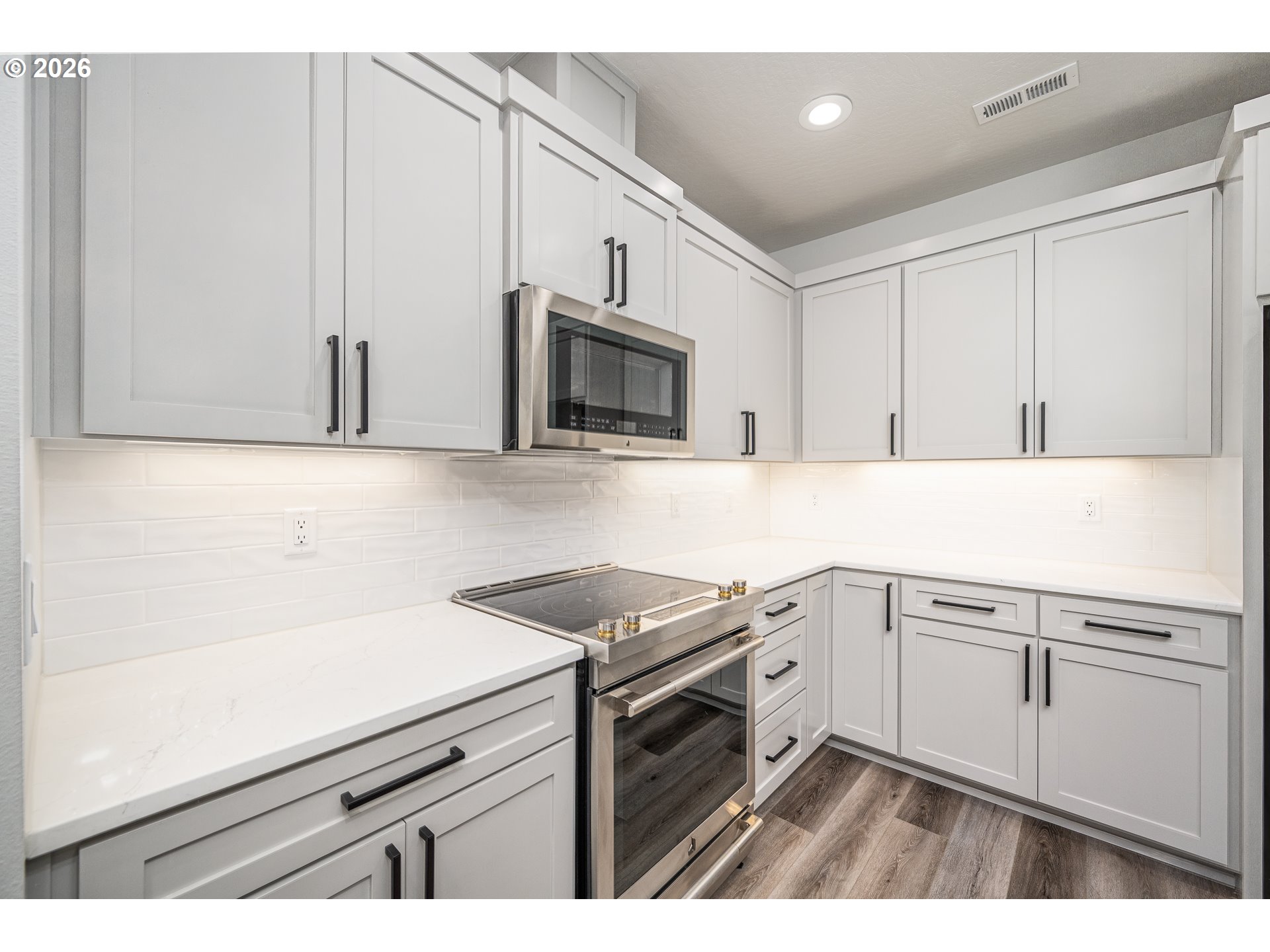 24678 Perkins Road, Unit LOT 26 Veneta, OR 97487 - Photo 17 of 48 a kitchen with a sink stove and microwave