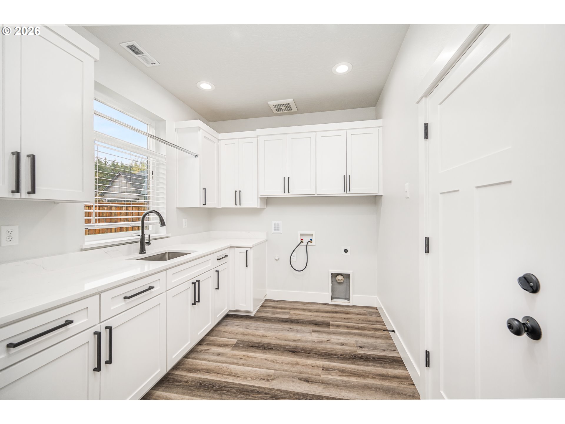 24678 Perkins Road, Unit LOT 26 Veneta, OR 97487 - Photo 20 of 48 a kitchen with white cabinets and window
