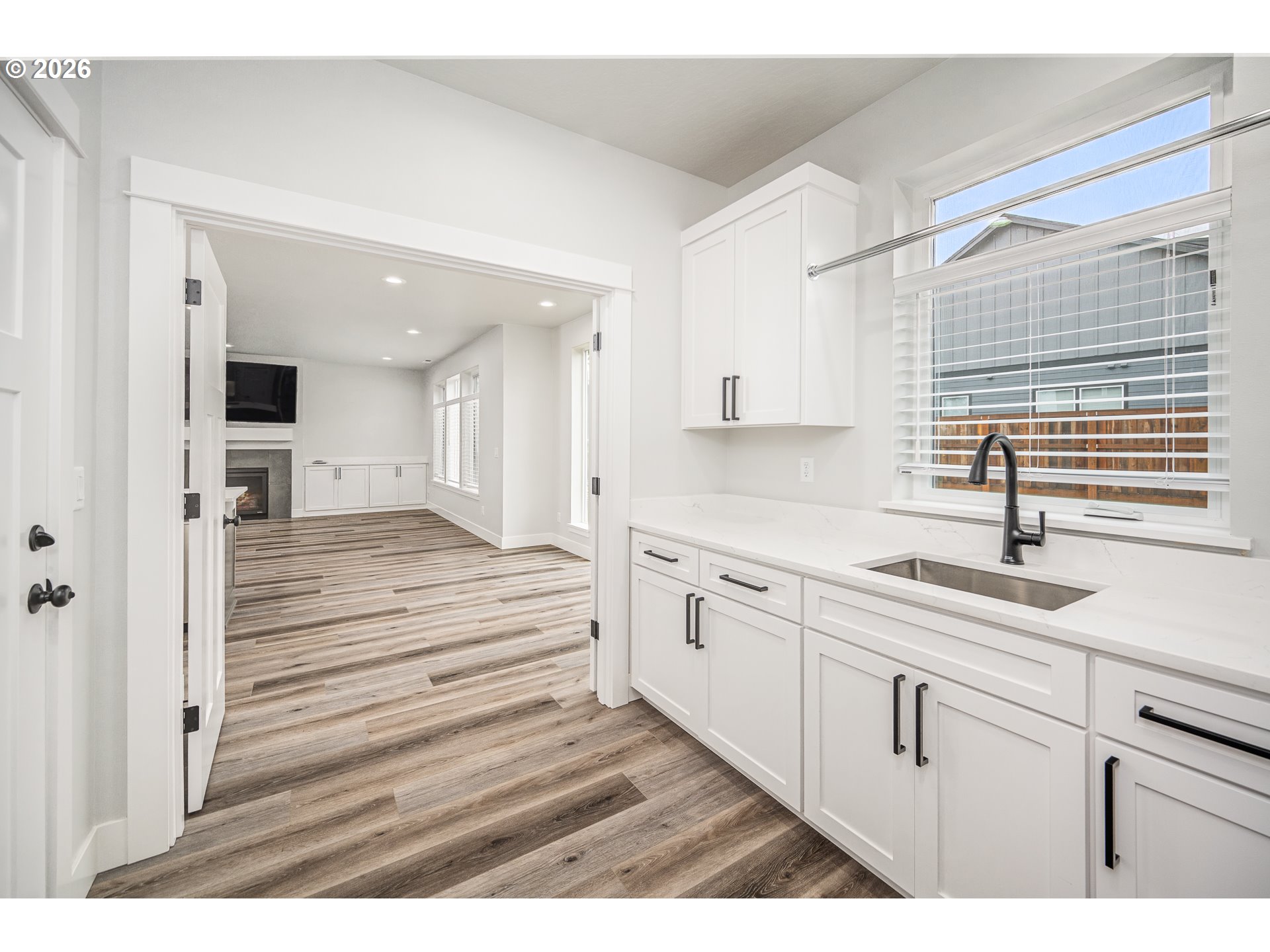 24678 Perkins Road, Unit LOT 26 Veneta, OR 97487 - Photo 21 of 48 a kitchen with granite countertop white cabinets and white appliances