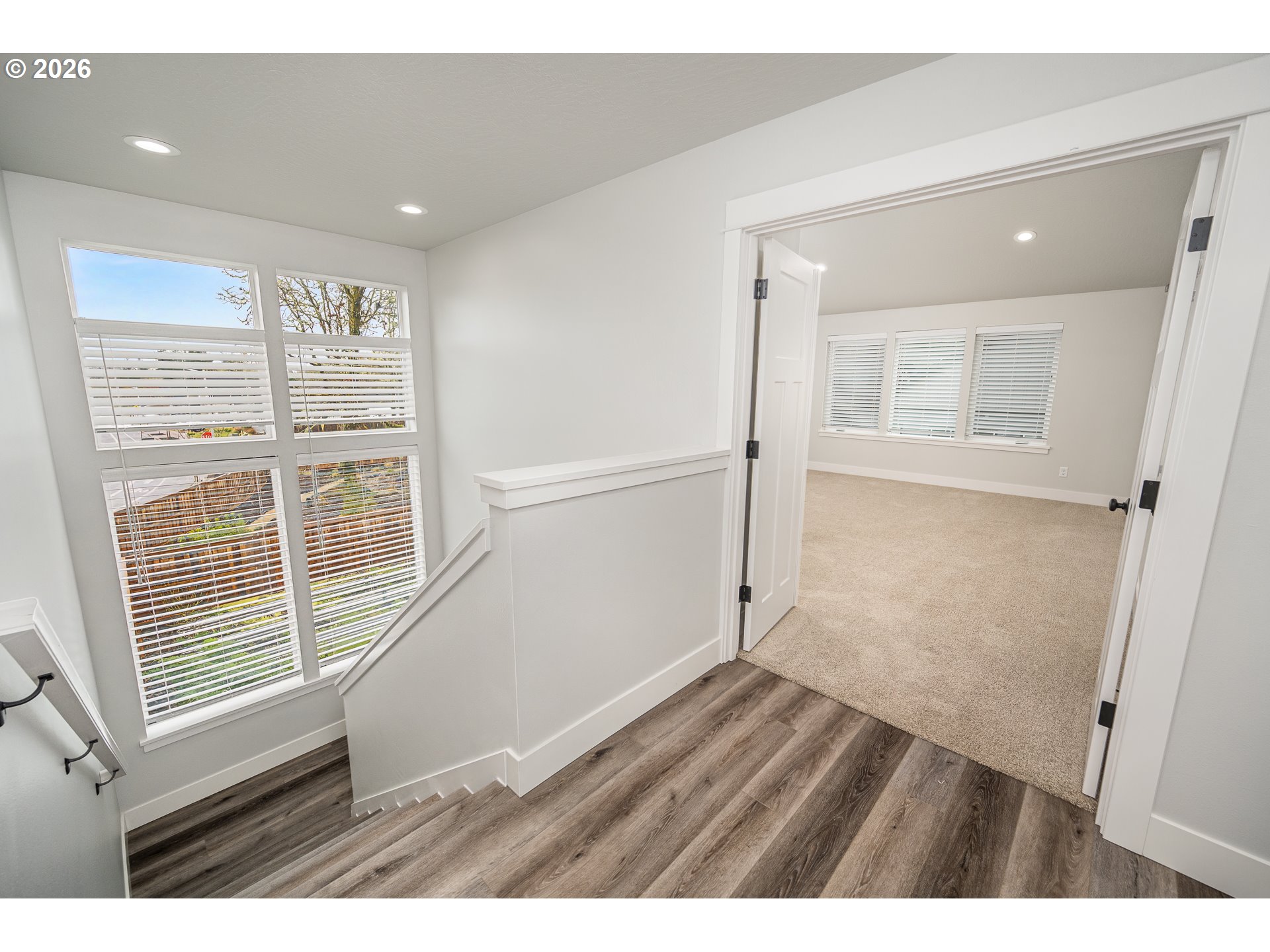 24678 Perkins Road, Unit LOT 26 Veneta, OR 97487 - Photo 22 of 48 a view of an empty room with wooden floor and a window