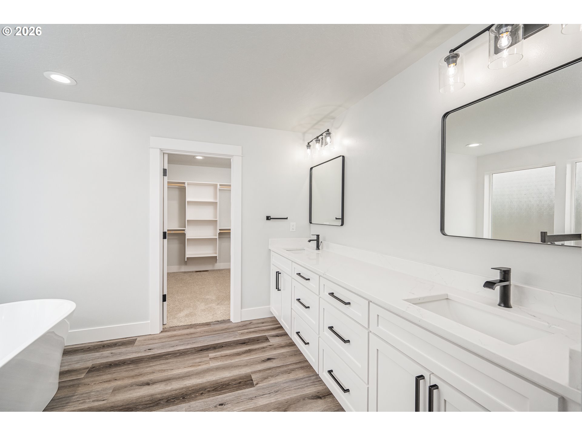 24678 Perkins Road, Unit LOT 26 Veneta, OR 97487 - Photo 26 of 48 a bathroom with double vanity sink and mirror