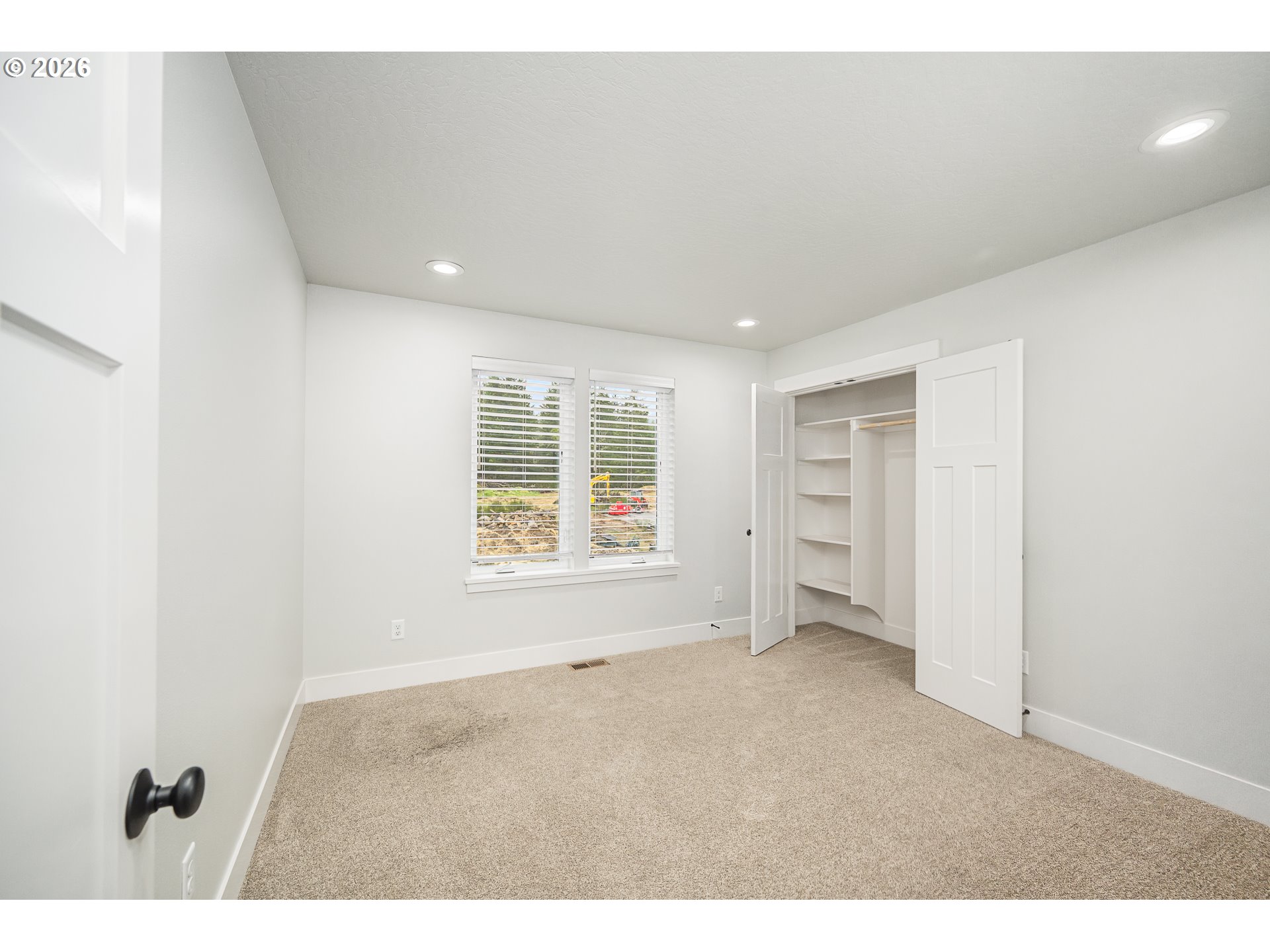 24678 Perkins Road, Unit LOT 26 Veneta, OR 97487 - Photo 32 of 48 a view of an empty room with a window