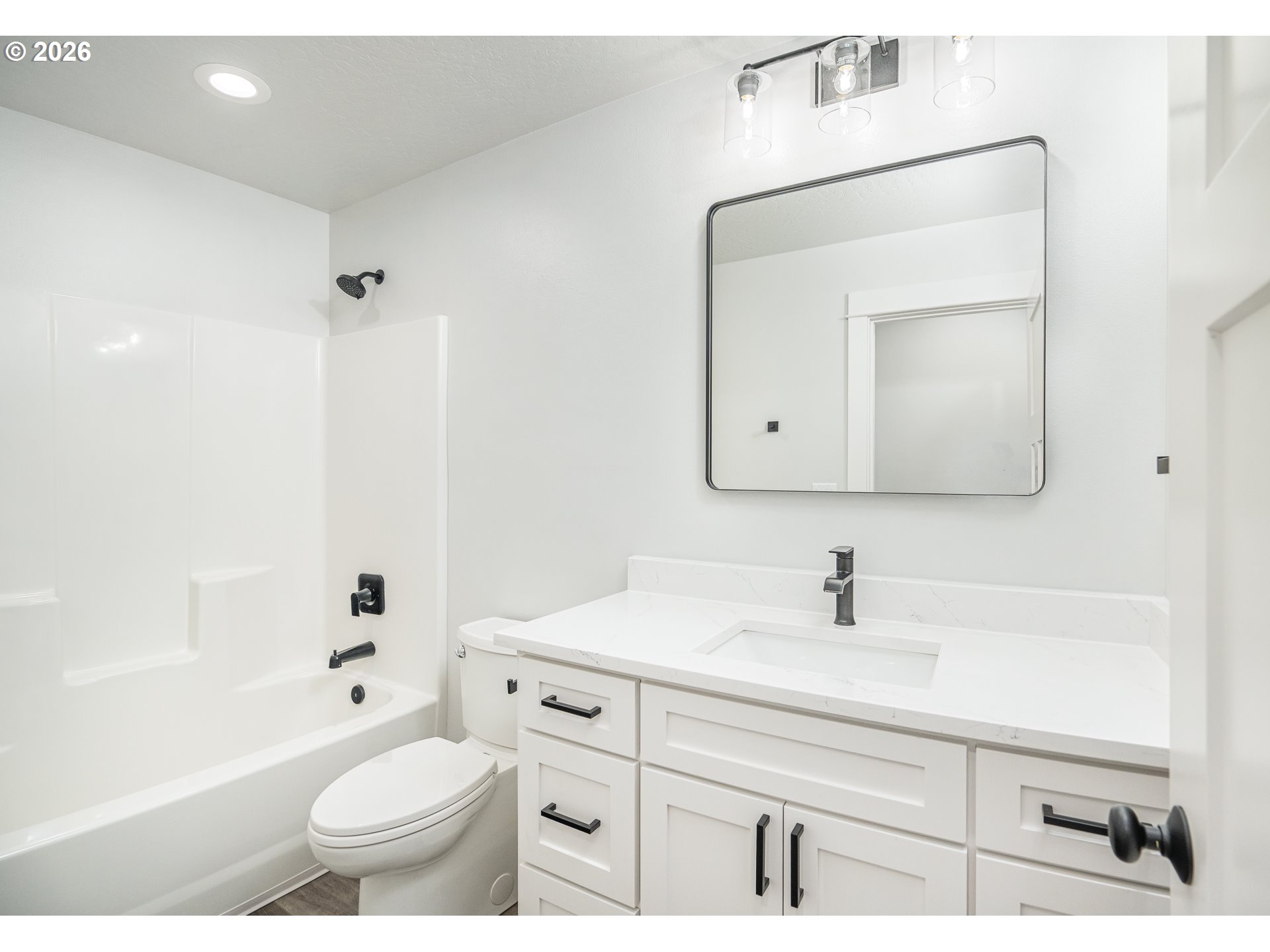 24678 Perkins Road, Unit LOT 26 Veneta, OR 97487 - Photo 35 of 48 a bathroom with a sink toilet a mirror and shower