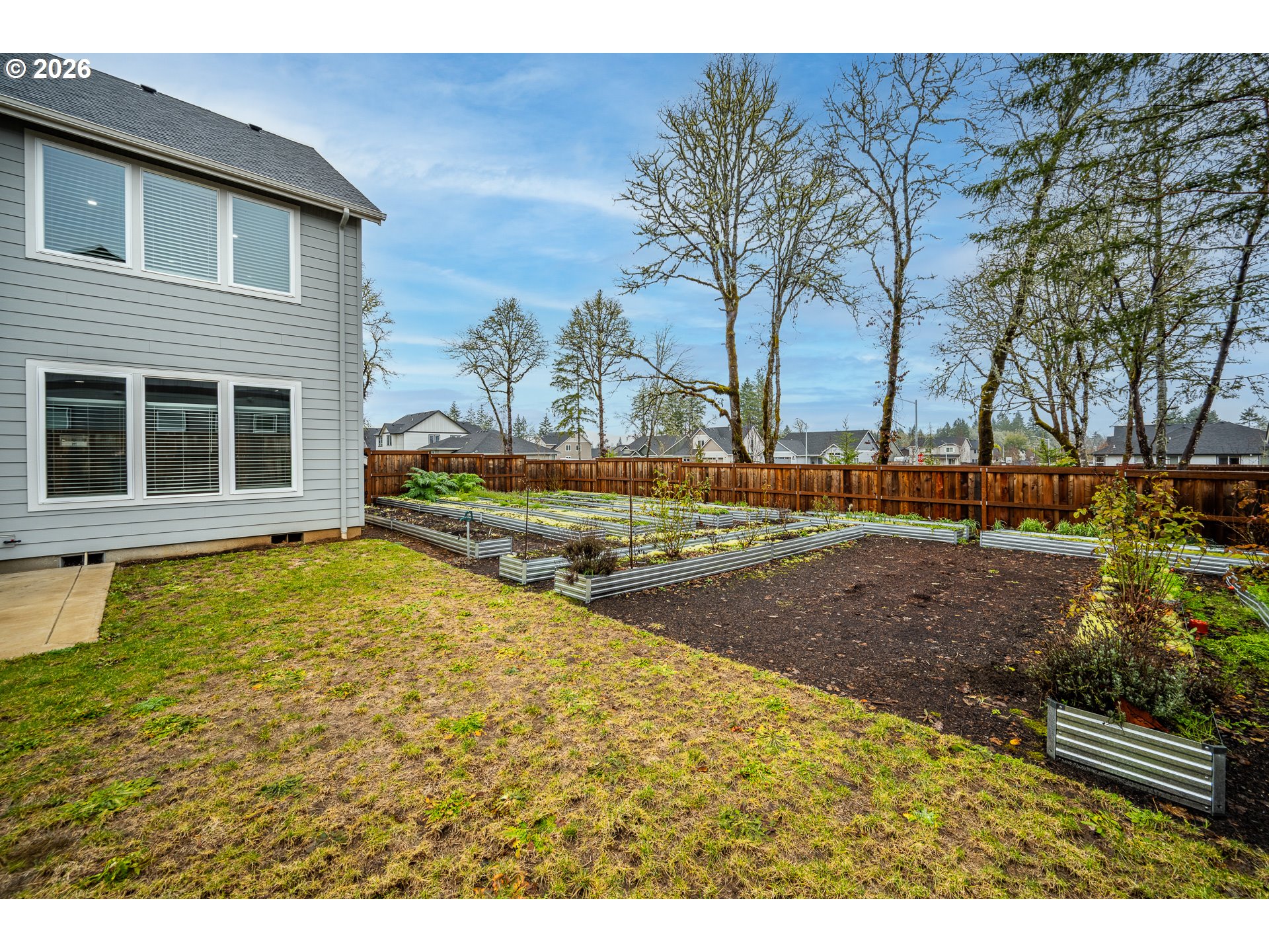24678 Perkins Road, Unit LOT 26 Veneta, OR 97487 - Photo 36 of 48 a view of a house with backyard and trees