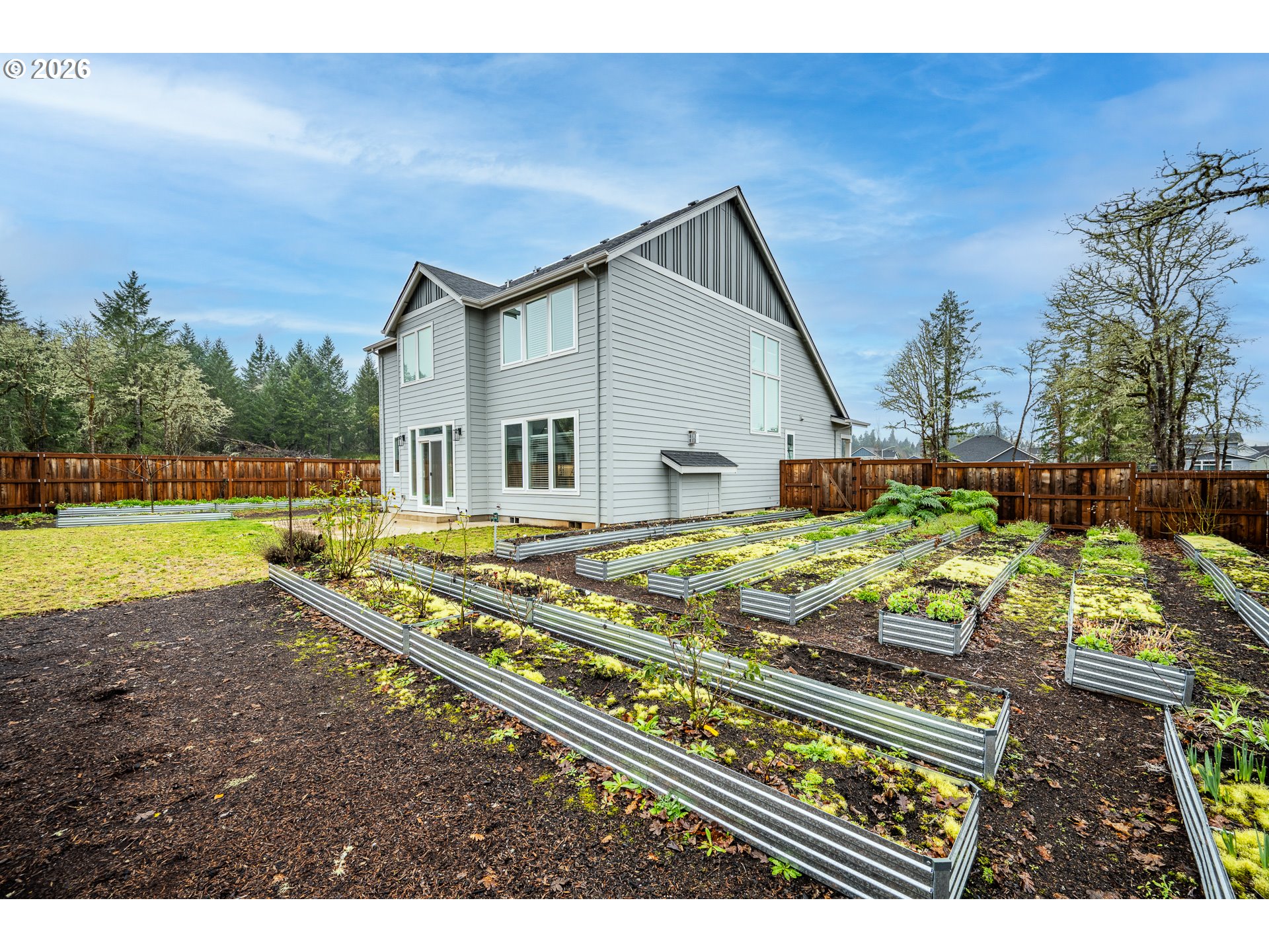 24678 Perkins Road, Unit LOT 26 Veneta, OR 97487 - Photo 37 of 48 a view of a house with a yard