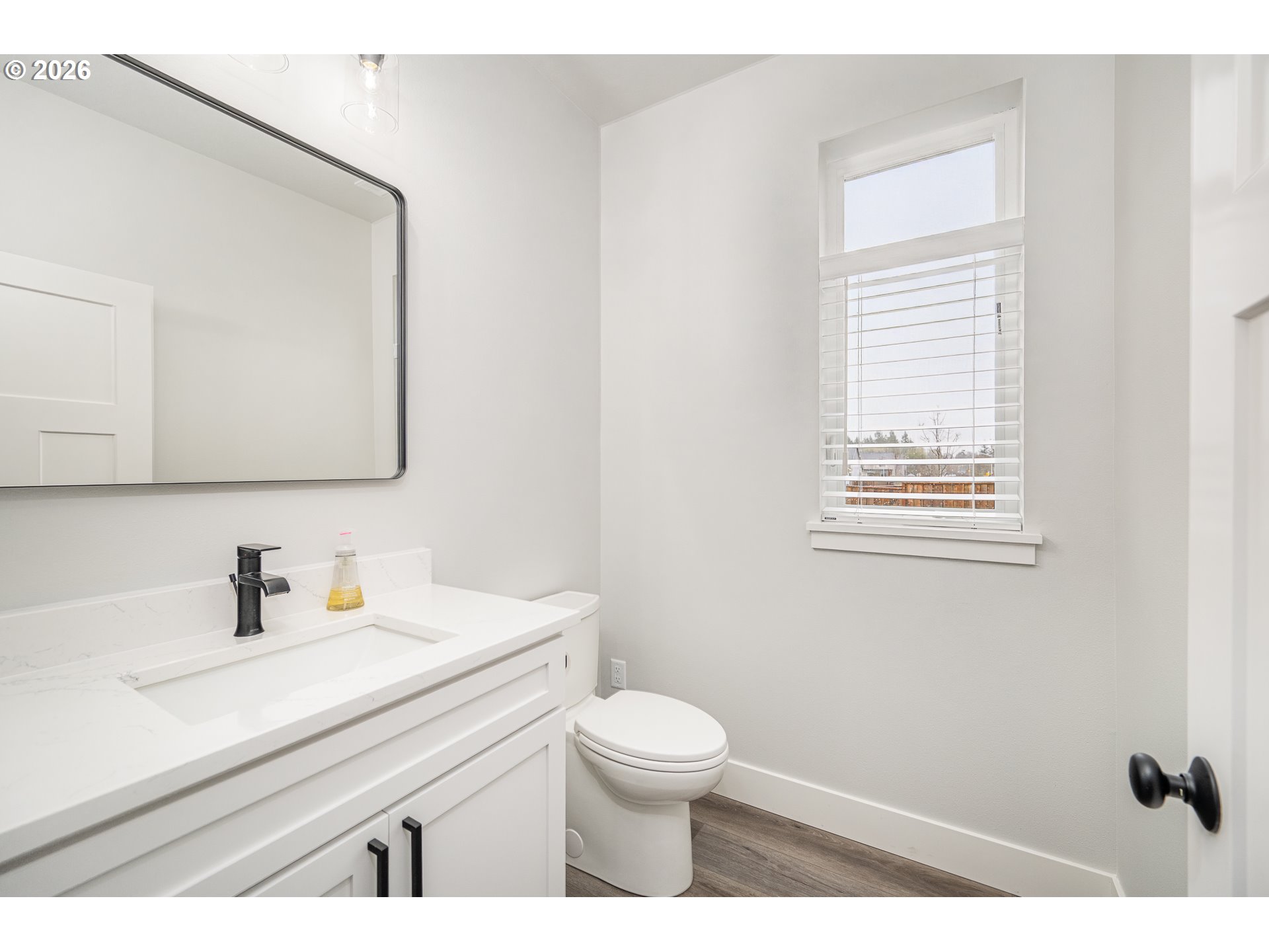 24678 Perkins Road, Unit LOT 26 Veneta, OR 97487 - Photo 6 of 48 a bathroom with a sink a toilet and a mirror