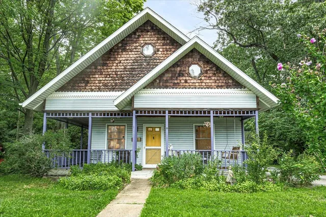 a view of a backyard with sitting area