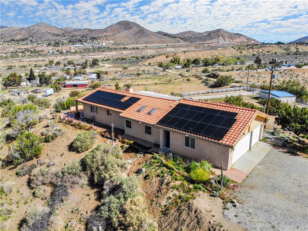 a view of a houses with a mountain
