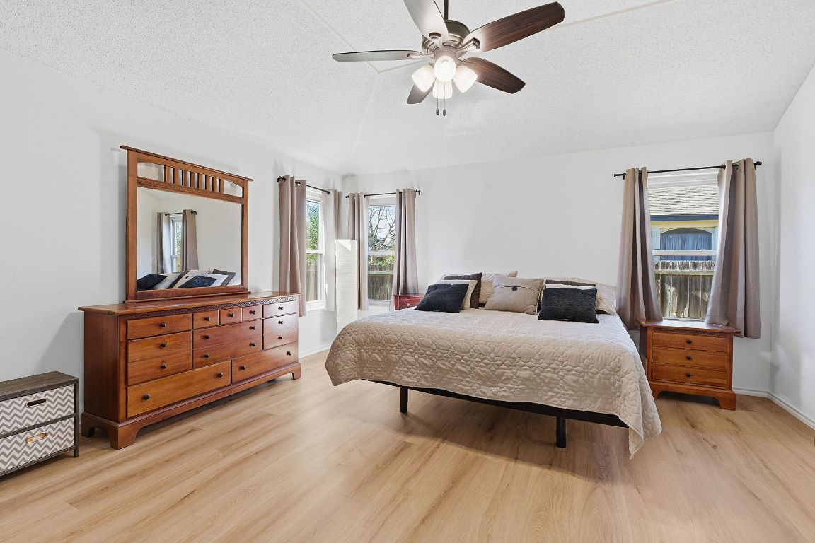 1203 Crossvine Way Pflugerville, TX 78660 - Photo 11 of 22 a bedroom with a bed and window