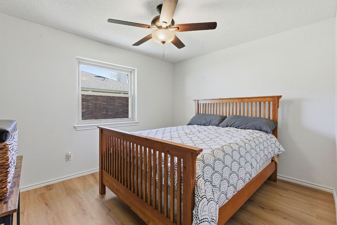 1203 Crossvine Way Pflugerville, TX 78660 - Photo 15 of 22 a bedroom with a bed and a window