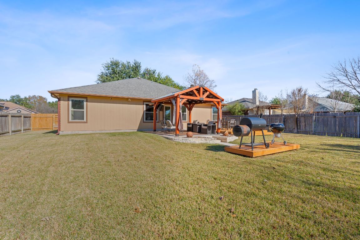 1203 Crossvine Way Pflugerville, TX 78660 - Photo 19 of 22 a view of a house with a swimming pool and sitting area