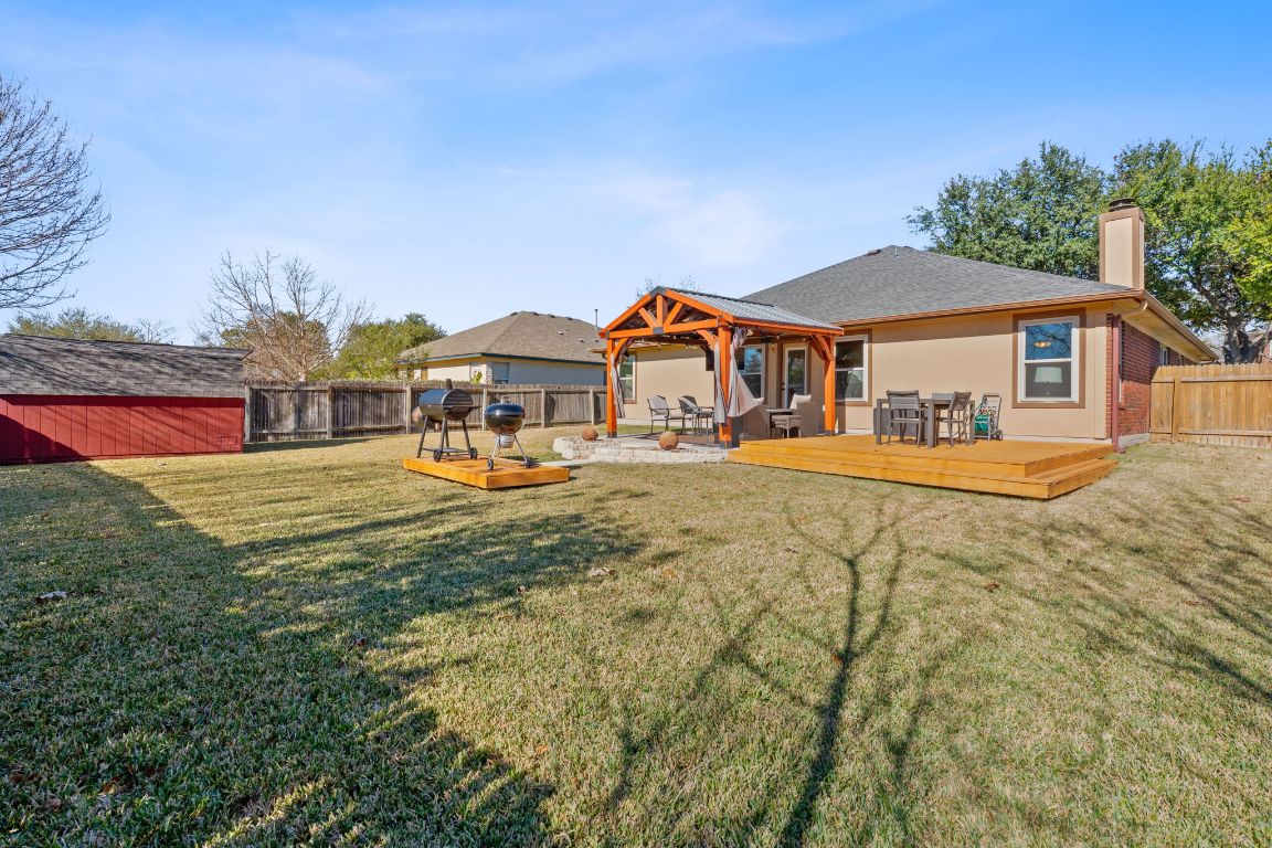 1203 Crossvine Way Pflugerville, TX 78660 - Photo 22 of 22 a front view of a house with a yard table and chairs