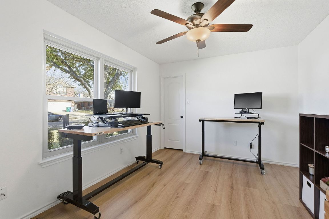 1203 Crossvine Way Pflugerville, TX 78660 - Photo 10 of 22 a kitchen with kitchen island a counter top space appliances and a window