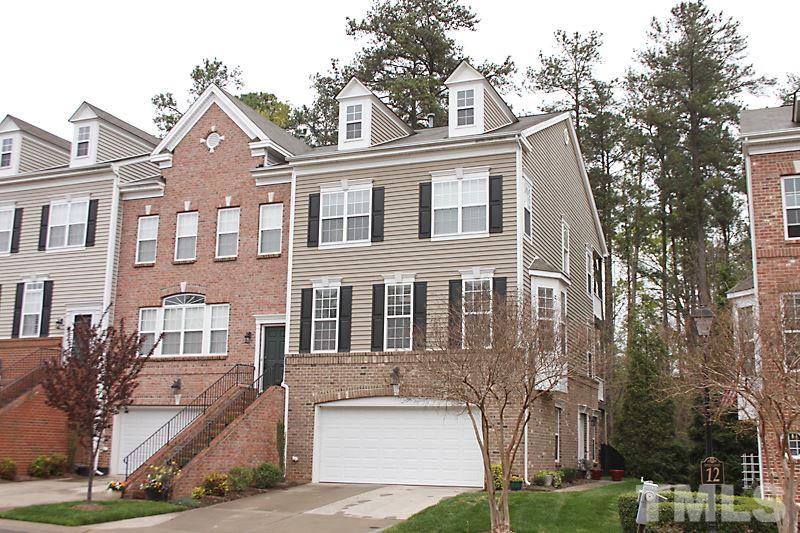 3520 Edgemont Drive Raleigh, NC 27612 - Photo 1 of 12 a front view of a house with a yard
