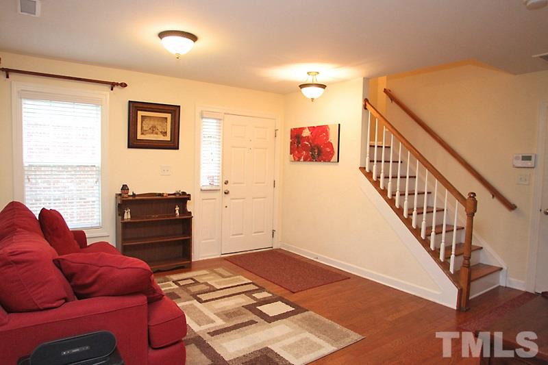 3520 Edgemont Drive Raleigh, NC 27612 - Photo 2 of 12 a living room with furniture and a flat screen tv