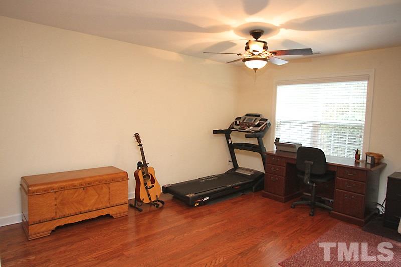 3520 Edgemont Drive Raleigh, NC 27612 - Photo 3 of 12 a bedroom with bed window and a desk