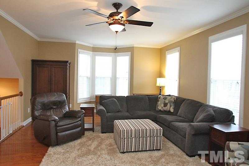 3520 Edgemont Drive Raleigh, NC 27612 - Photo 5 of 12 a living room with furniture and a window
