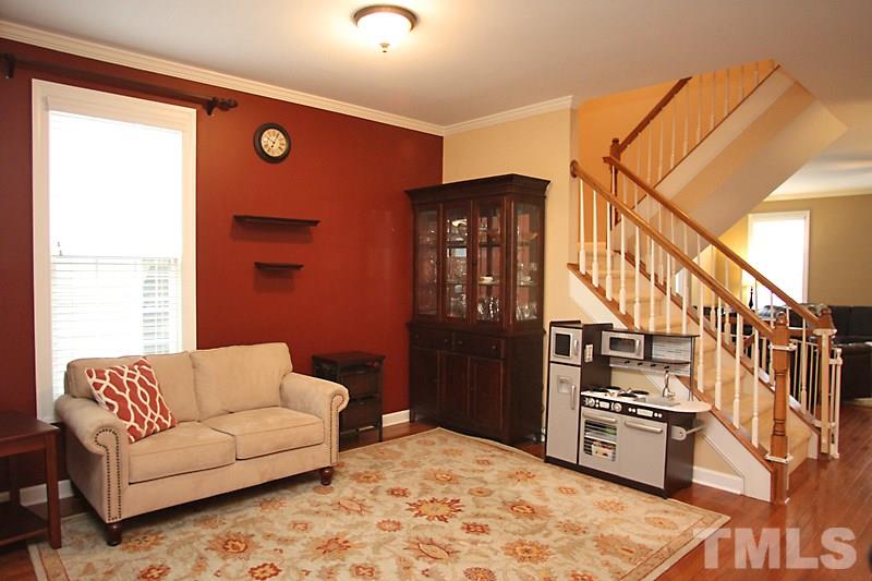3520 Edgemont Drive Raleigh, NC 27612 - Photo 6 of 12 a living room with stainless steel appliances kitchen island granite countertop a refrigerator and a stove top oven