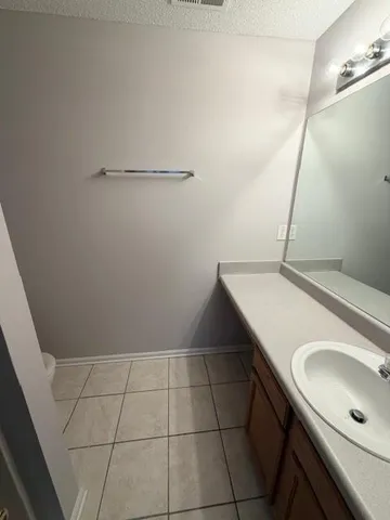 a bathroom with a sink and mirror