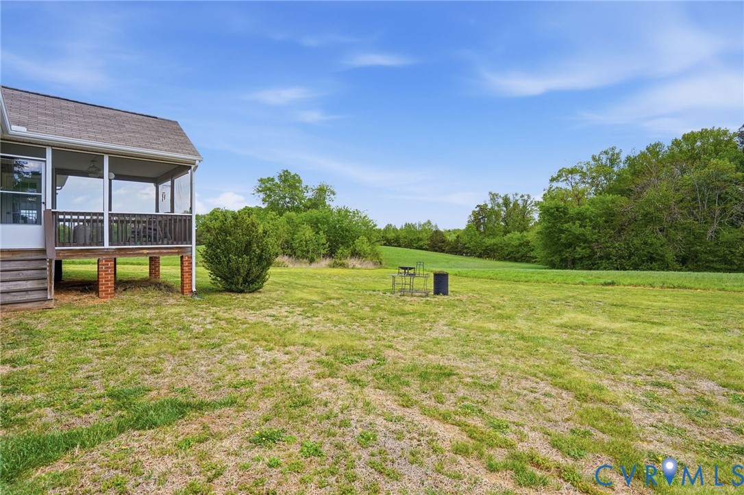 19012 Teman Road Beaverdam, VA 23015 - Photo 35 of 41 a backyard of a house with table and chairs