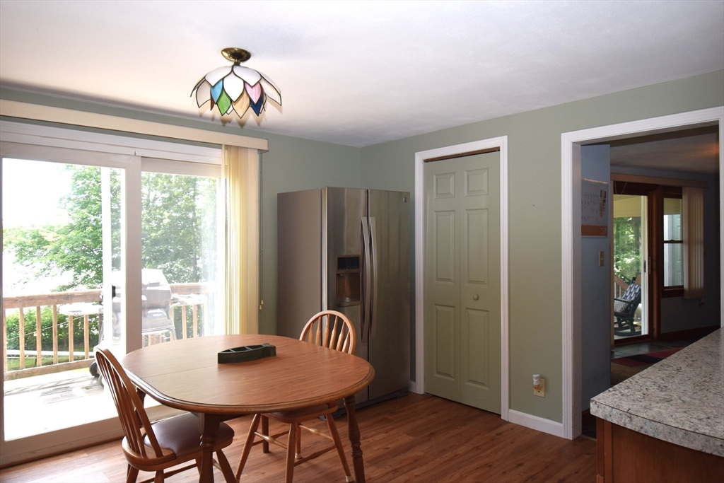 18 Holts Point Road Sandown, NH 03873 - Photo 13 of 34 a view of a dining room with furniture window and wooden floor