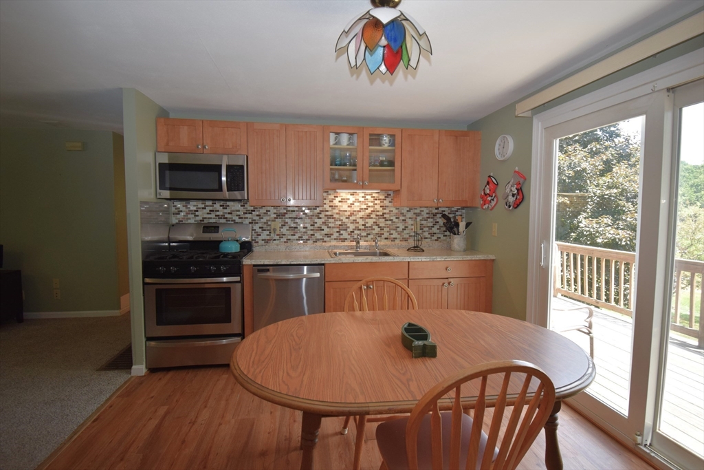 18 Holts Point Road Sandown, NH 03873 - Photo 14 of 34 a view of a dining room with furniture window and outside view