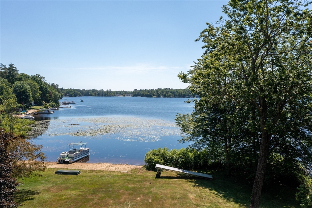 18 Holts Point Road Sandown, NH 03873 - Photo 4 of 34 a view of a lake with houses in outdoor space