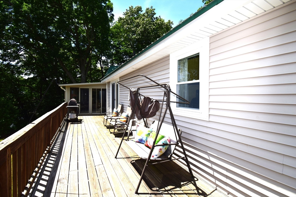 18 Holts Point Road Sandown, NH 03873 - Photo 8 of 34 a view of balcony with wooden floor and outdoor seating