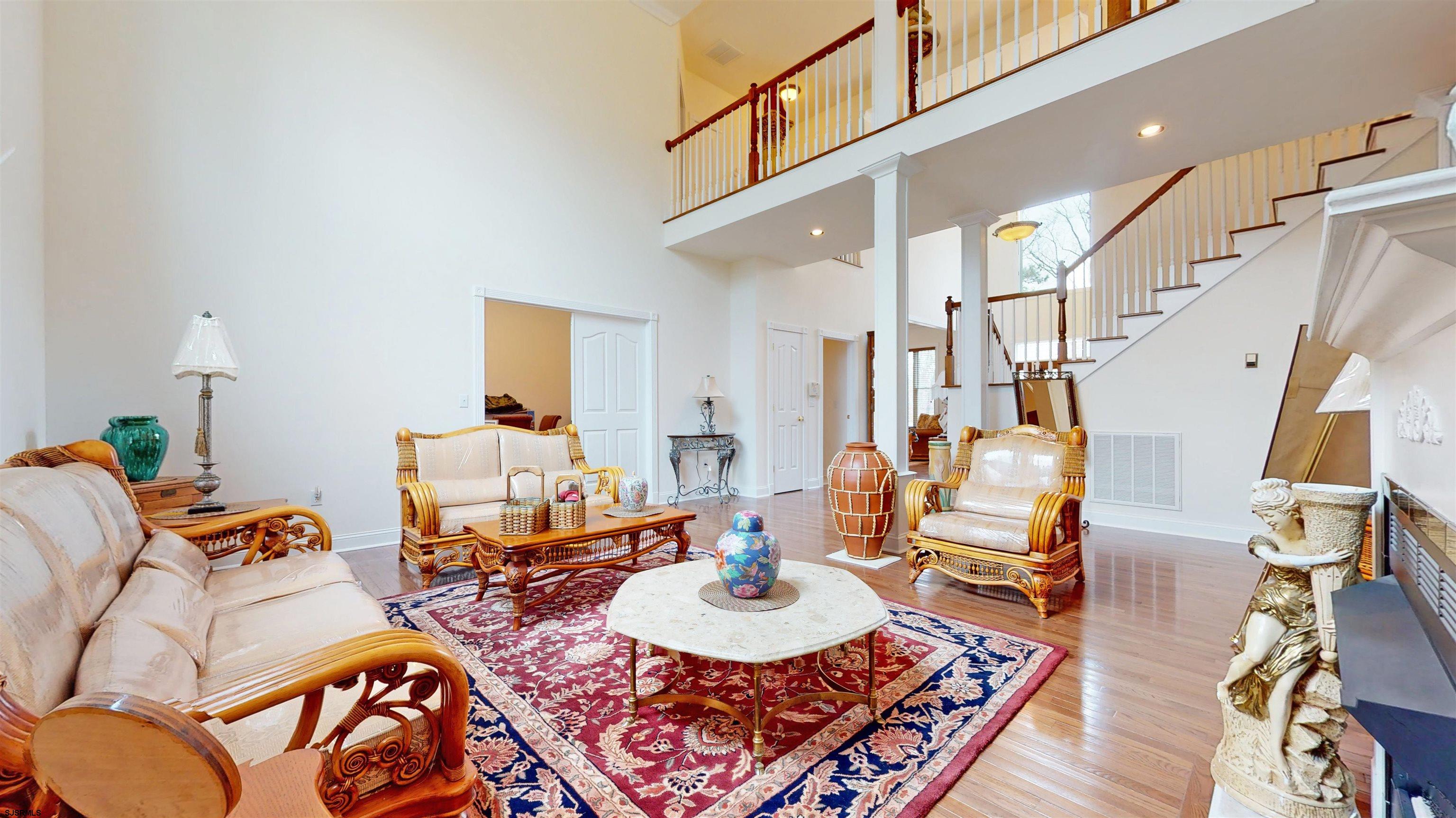 33 North New York Road Smithville, NJ 08205 - Photo 11 of 53 a living room with furniture and a dining table