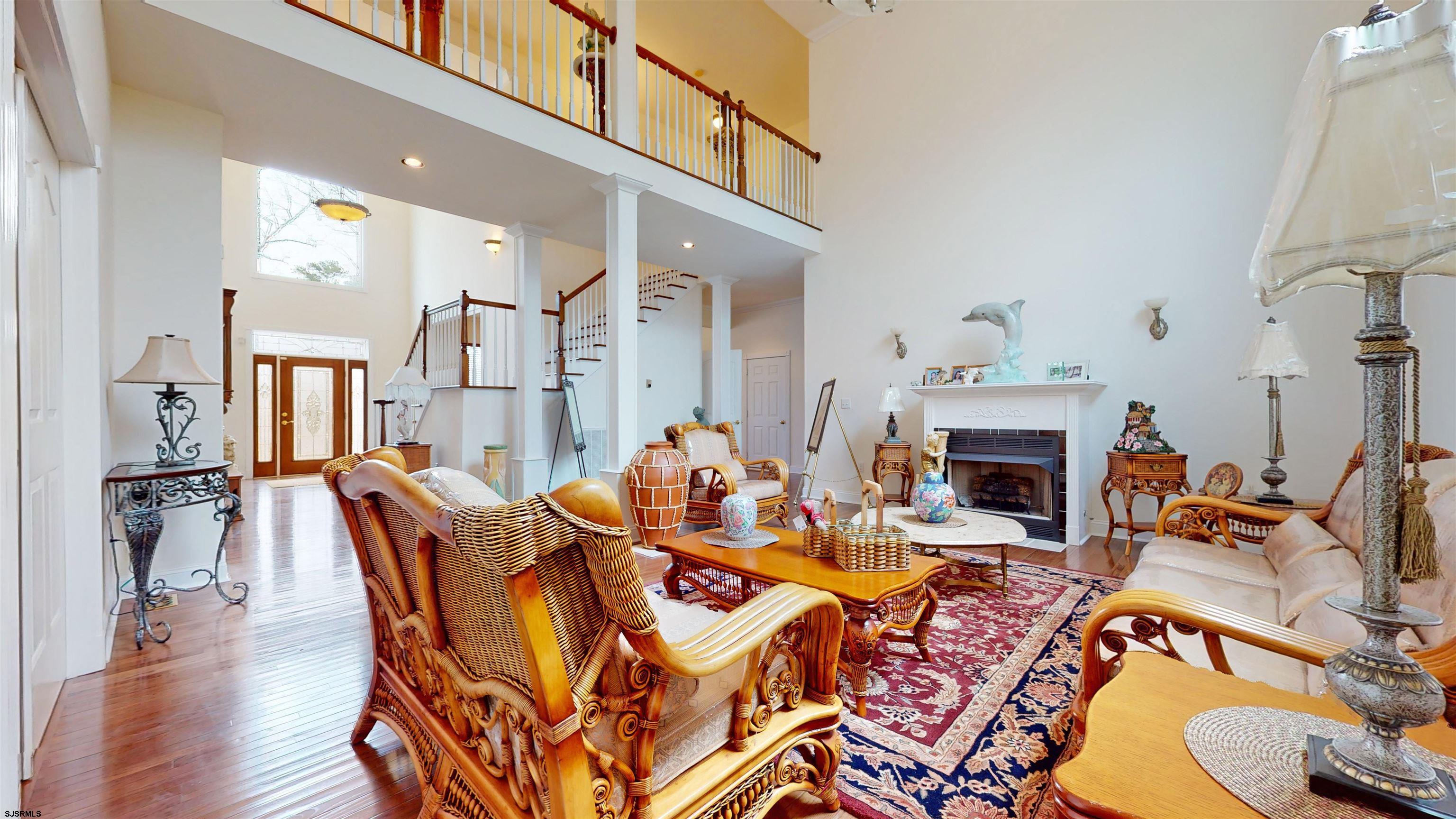 33 North New York Road Smithville, NJ 08205 - Photo 12 of 53 a view of a livingroom with furniture and a fireplace