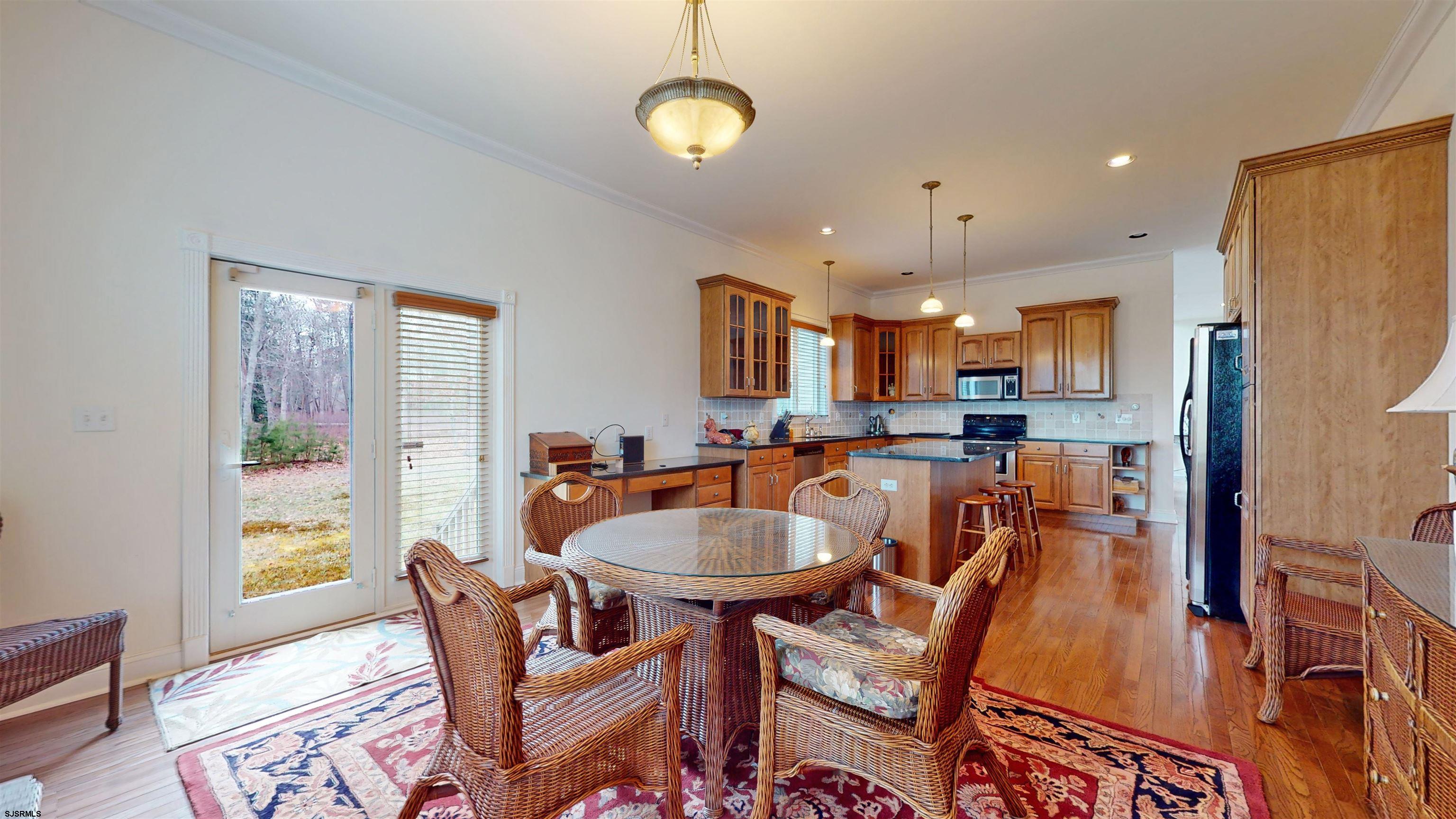 33 North New York Road Smithville, NJ 08205 - Photo 18 of 53 a view of a dining room with furniture window and wooden floor