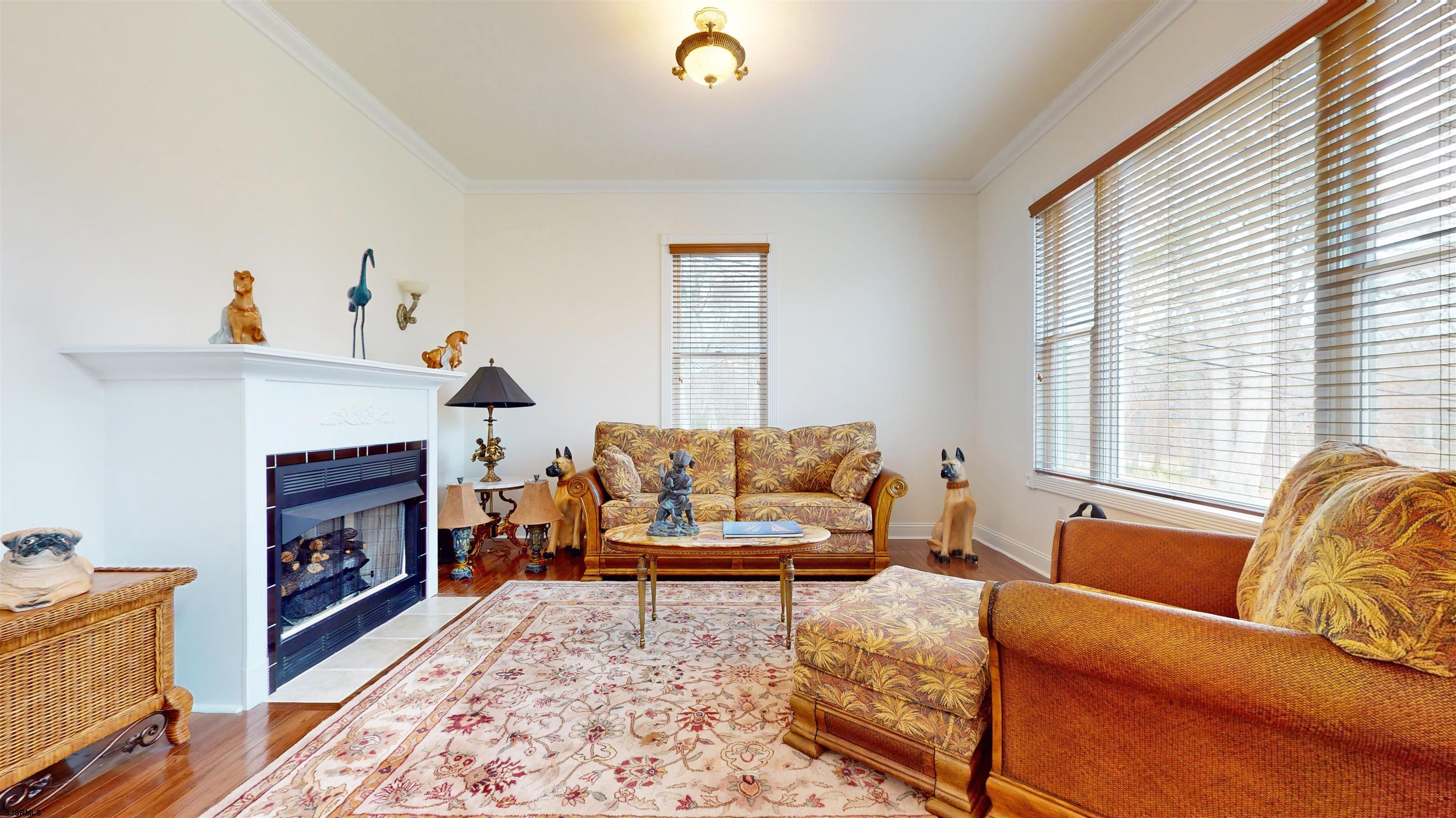 33 North New York Road Smithville, NJ 08205 - Photo 20 of 53 a living room with furniture and a fireplace