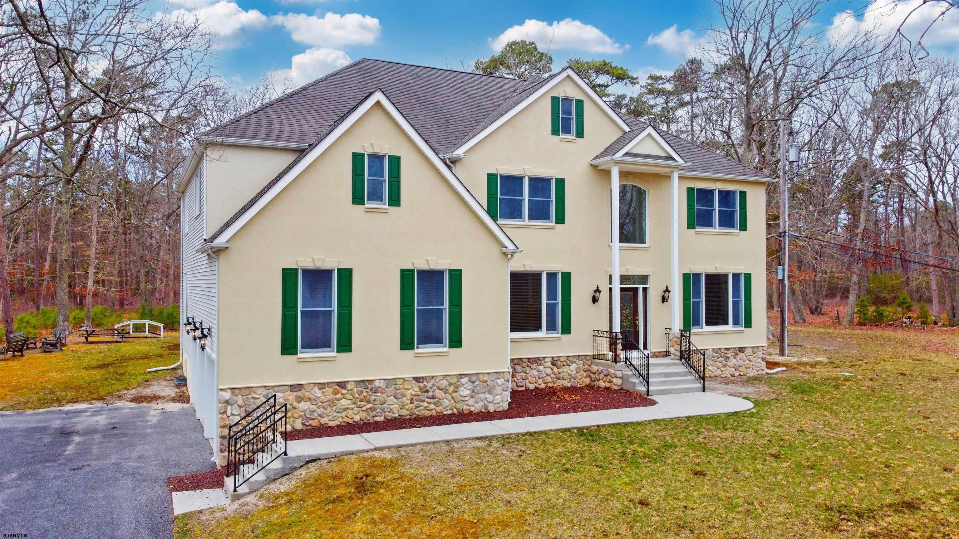 33 North New York Road Smithville, NJ 08205 - Photo 2 of 53 a front view of a house with a yard