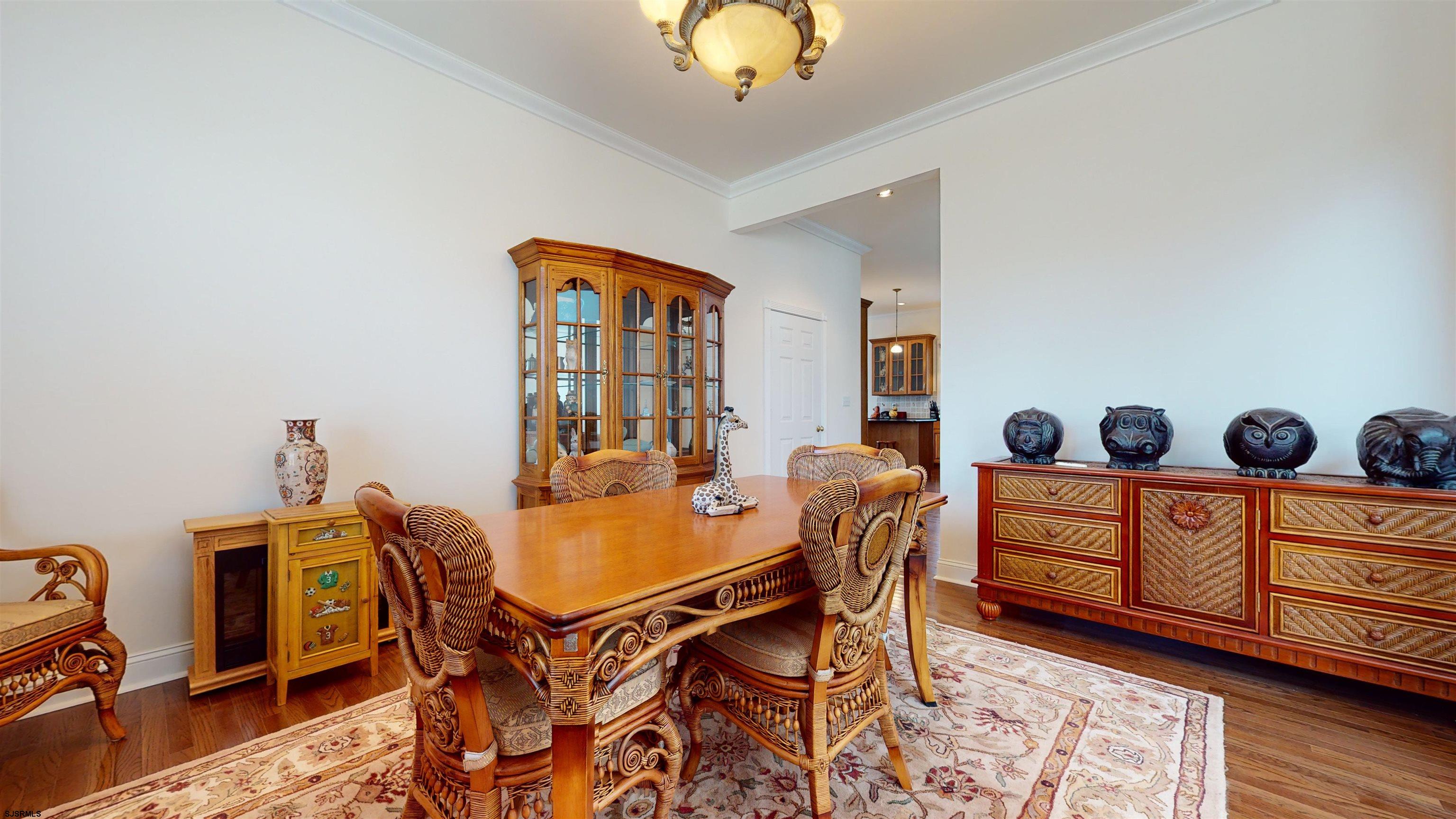 33 North New York Road Smithville, NJ 08205 - Photo 21 of 53 a view of a dining room with furniture and wooden floor
