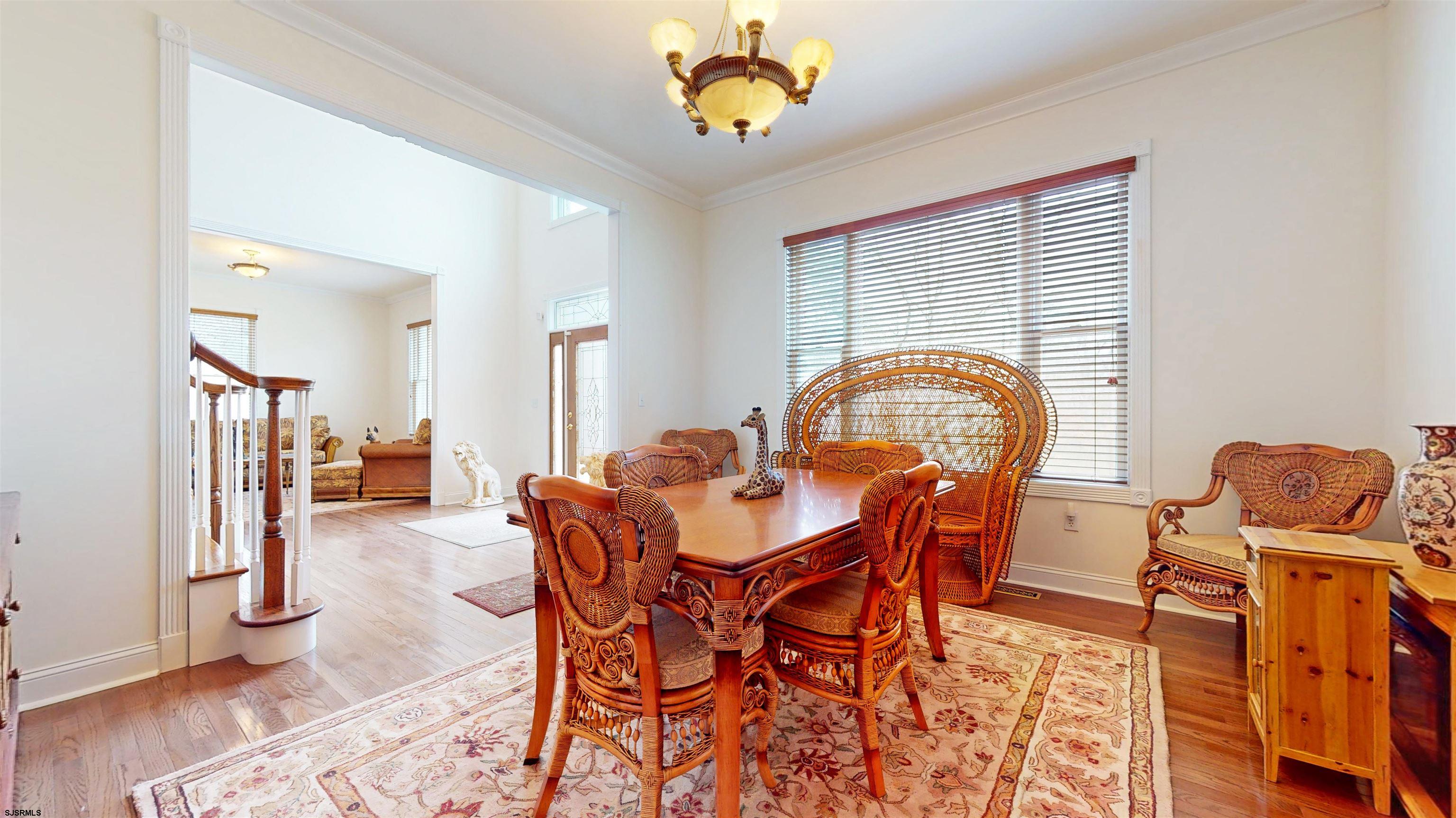 33 North New York Road Smithville, NJ 08205 - Photo 22 of 53 a dining room with furniture and wooden floor