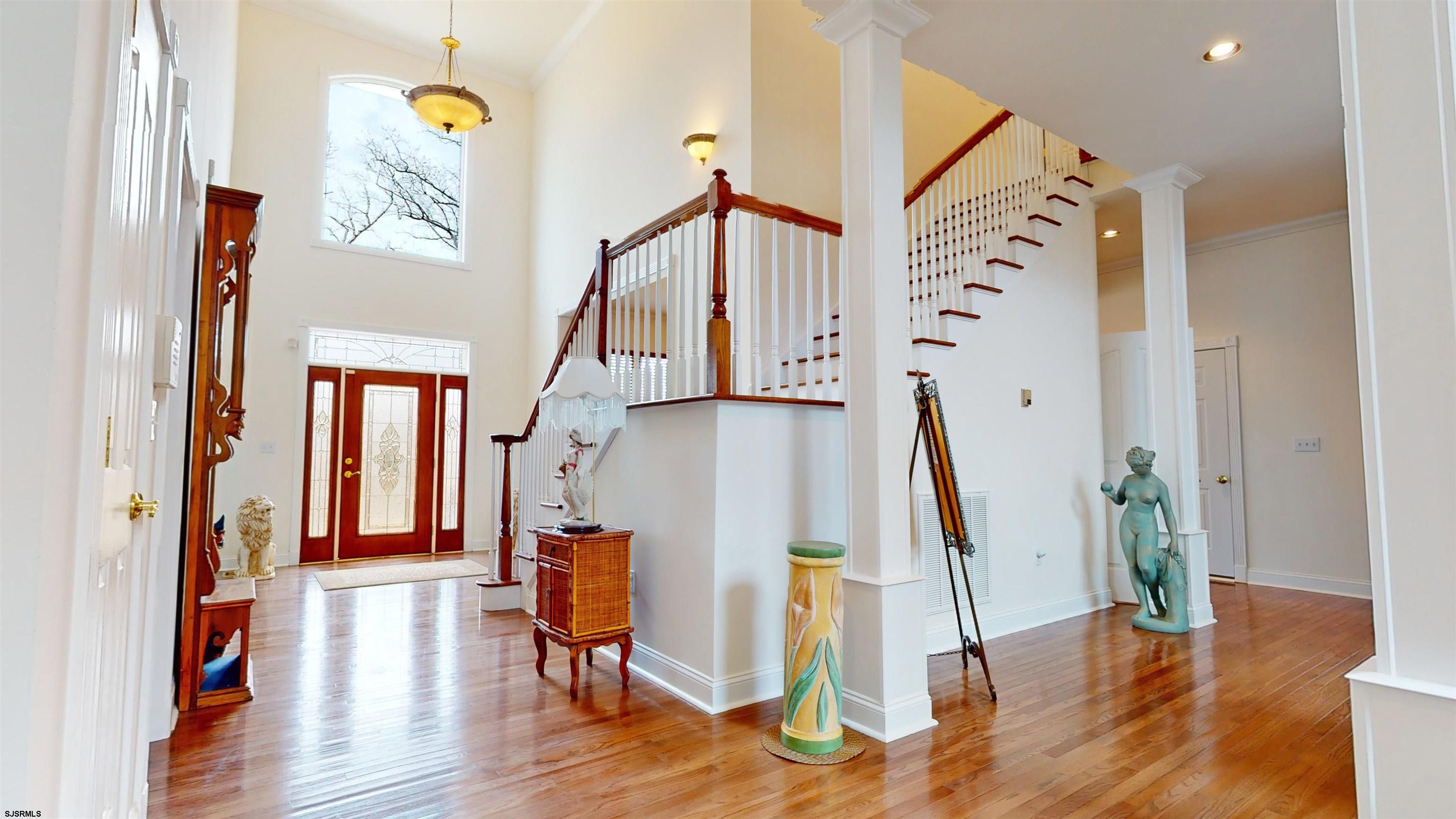 33 North New York Road Smithville, NJ 08205 - Photo 25 of 53 a view of entryway with wooden floor and stairs