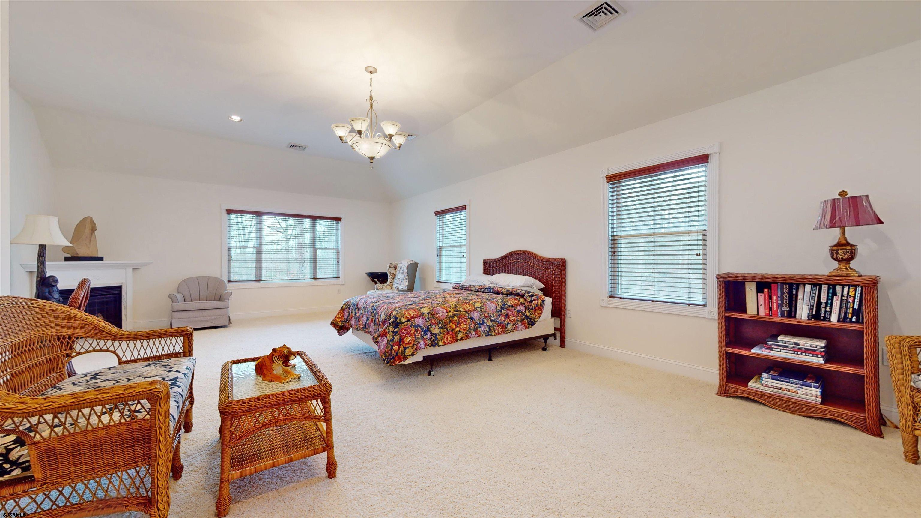 33 North New York Road Smithville, NJ 08205 - Photo 28 of 53 a bedroom with bed and a book shelf