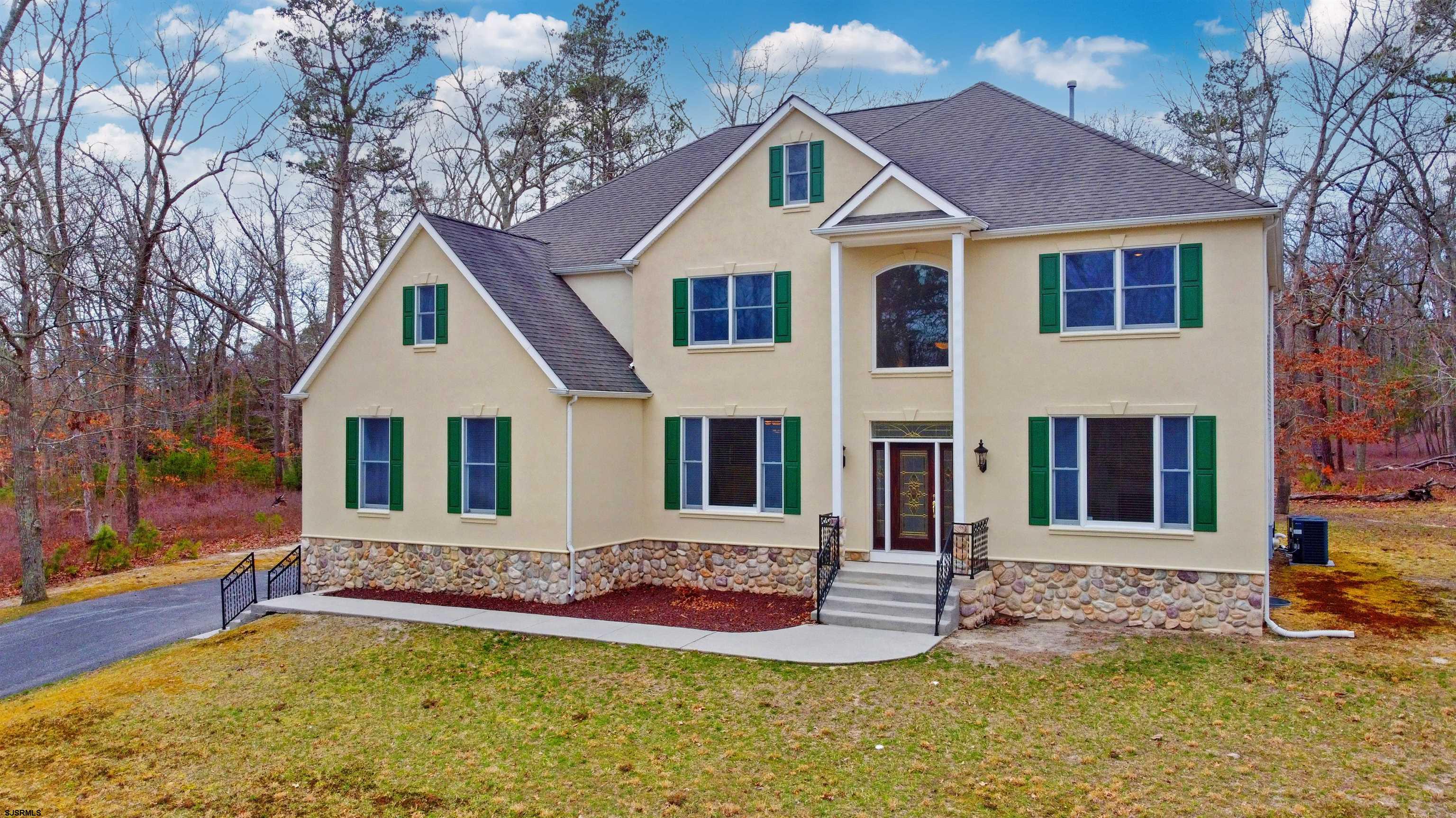 33 North New York Road Smithville, NJ 08205 - Photo 3 of 53 a front view of a house with a yard