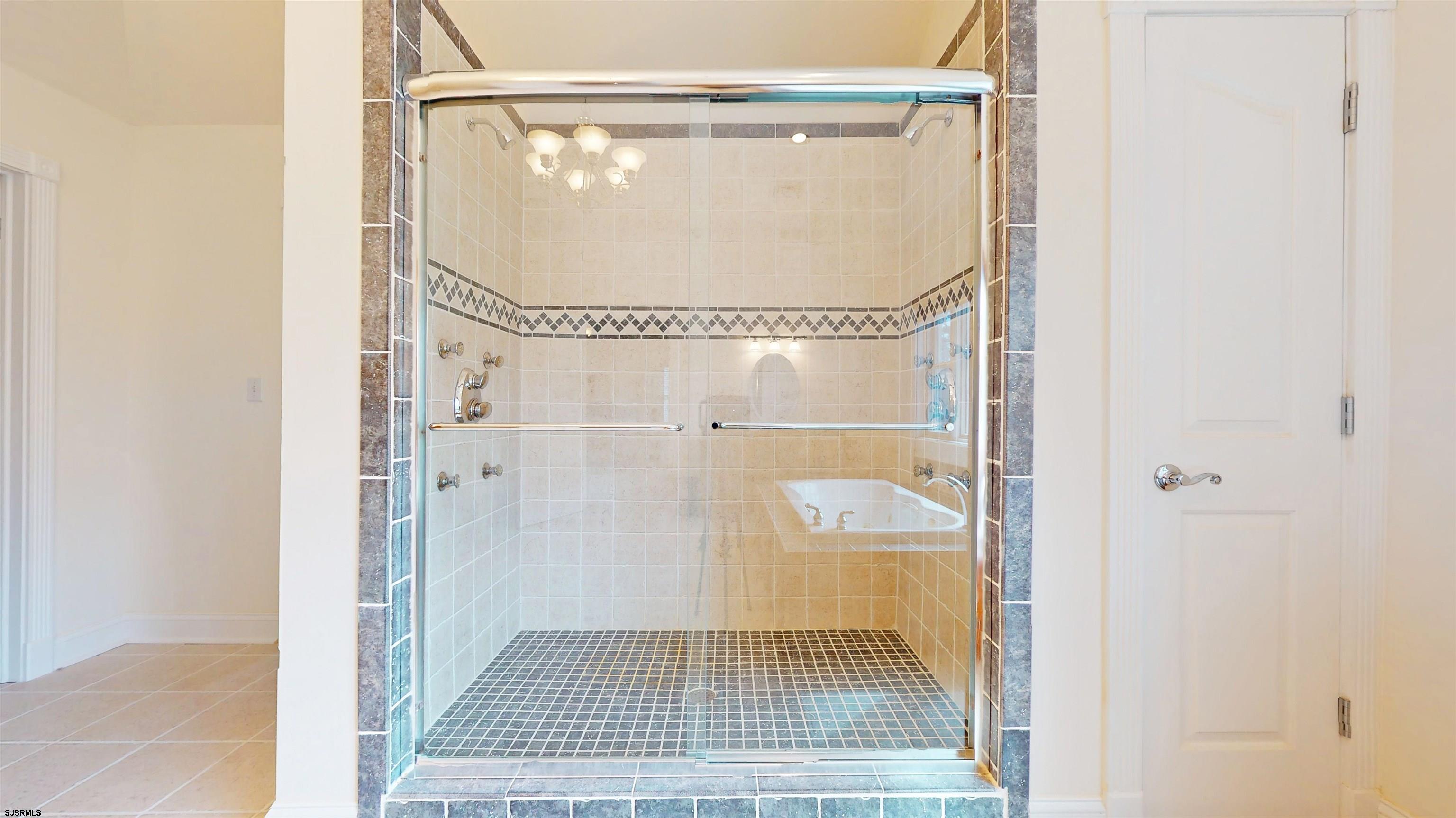 33 North New York Road Smithville, NJ 08205 - Photo 32 of 53 a bathroom with a glass shower door