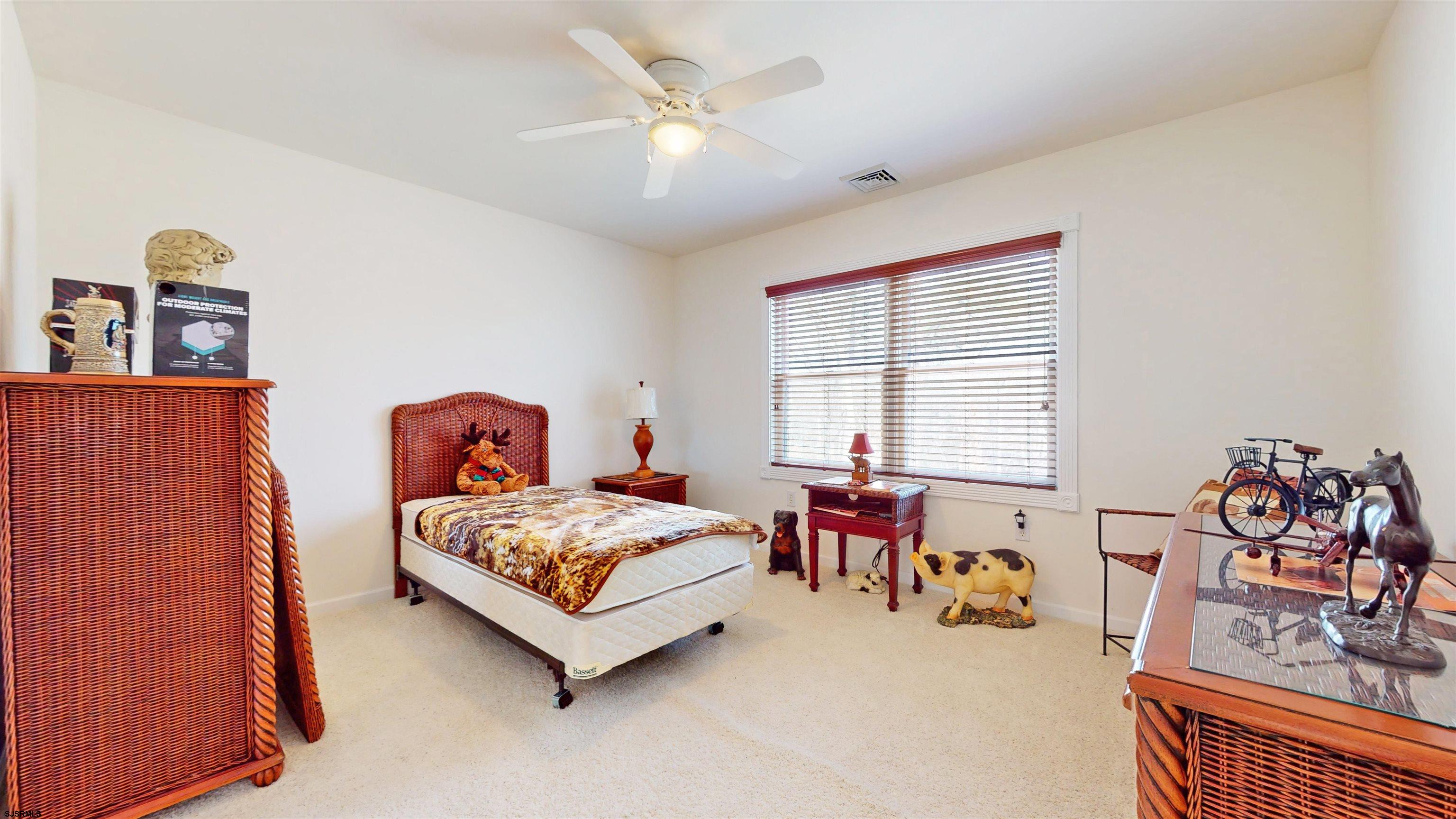 33 North New York Road Smithville, NJ 08205 - Photo 34 of 53 a bedroom with bed and a couch