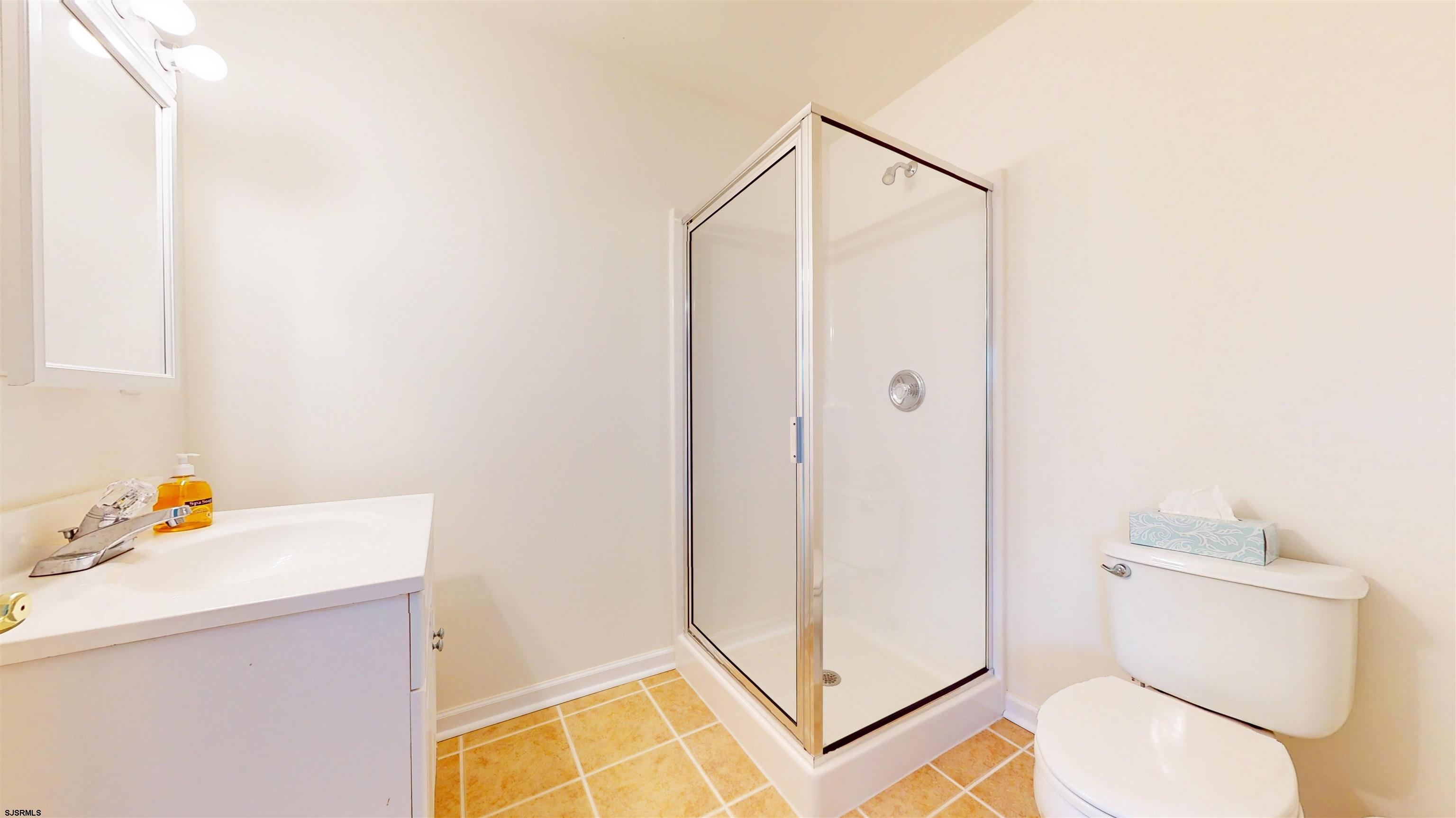 33 North New York Road Smithville, NJ 08205 - Photo 37 of 53 a bathroom with a toilet and a shower