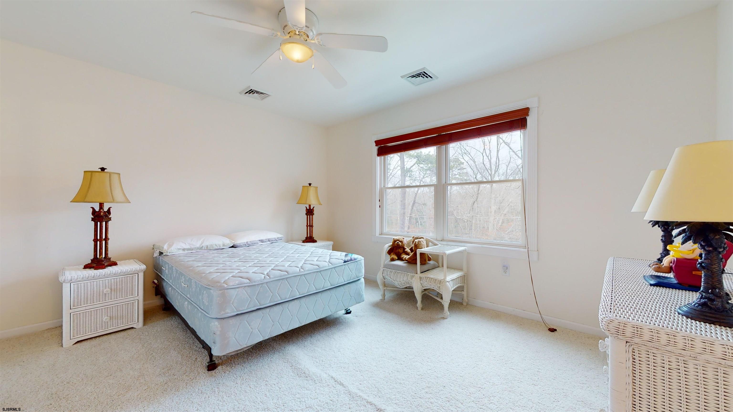33 North New York Road Smithville, NJ 08205 - Photo 40 of 53 a bedroom with bed and a window