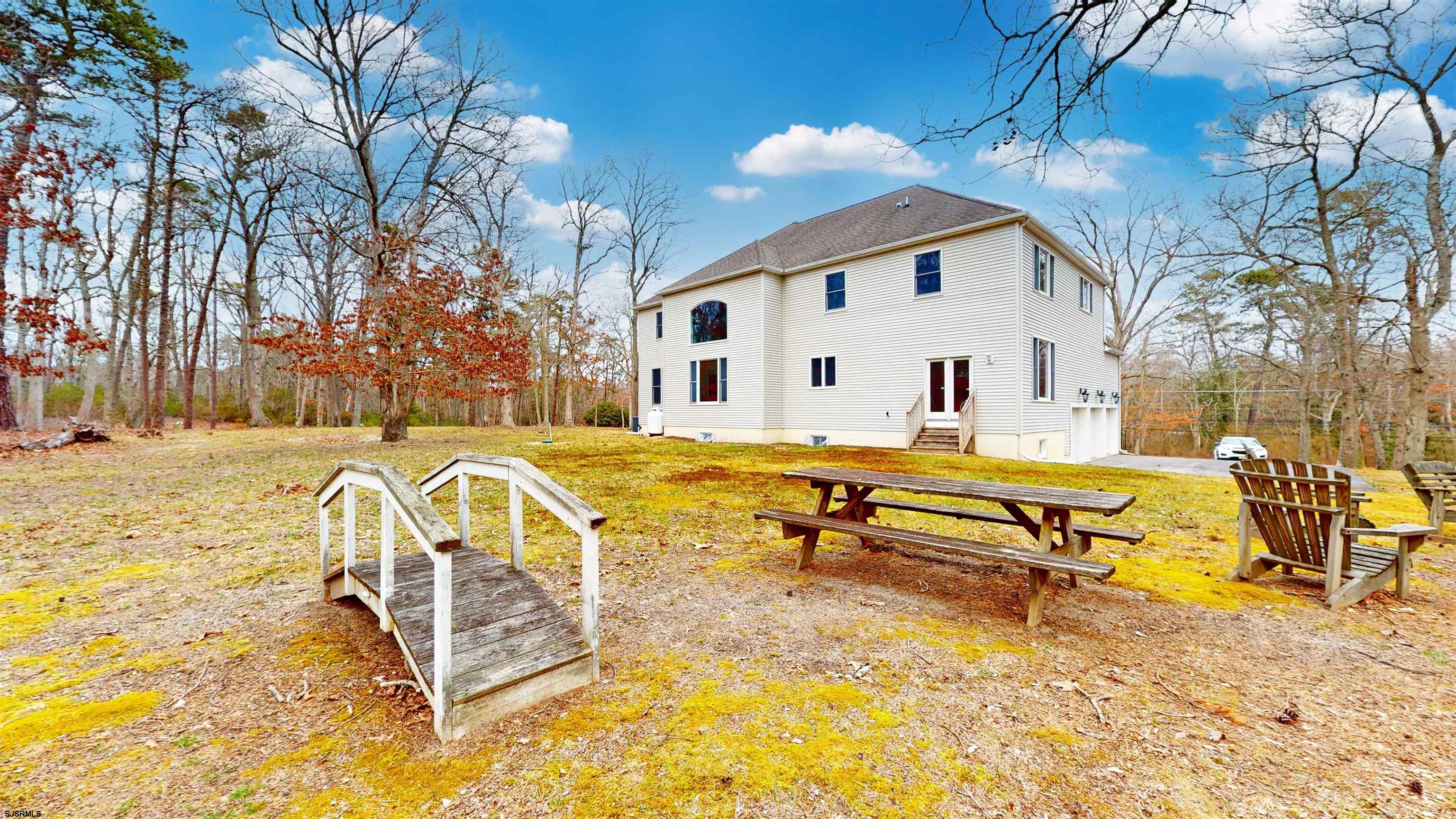 33 North New York Road Smithville, NJ 08205 - Photo 44 of 53 a swimming pool with outdoor seating and yard